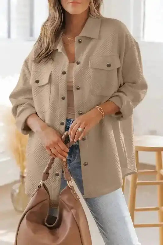 Textured plus size jacket in beige worn by model, featuring snap buttons and chest pockets for a cozy winter outfit.