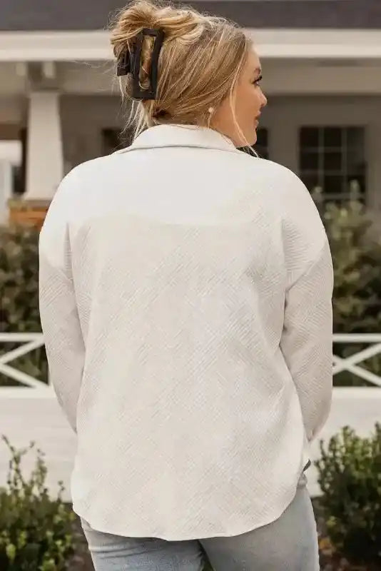 Back view of textured plus size jacket showcasing soft ribbed fabric and relaxed fit, ideal for cozy winter layering.