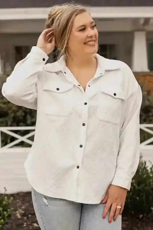 Front view of white textured plus size jacket with dual chest pockets and black snap buttons, perfect for everyday winter wear.