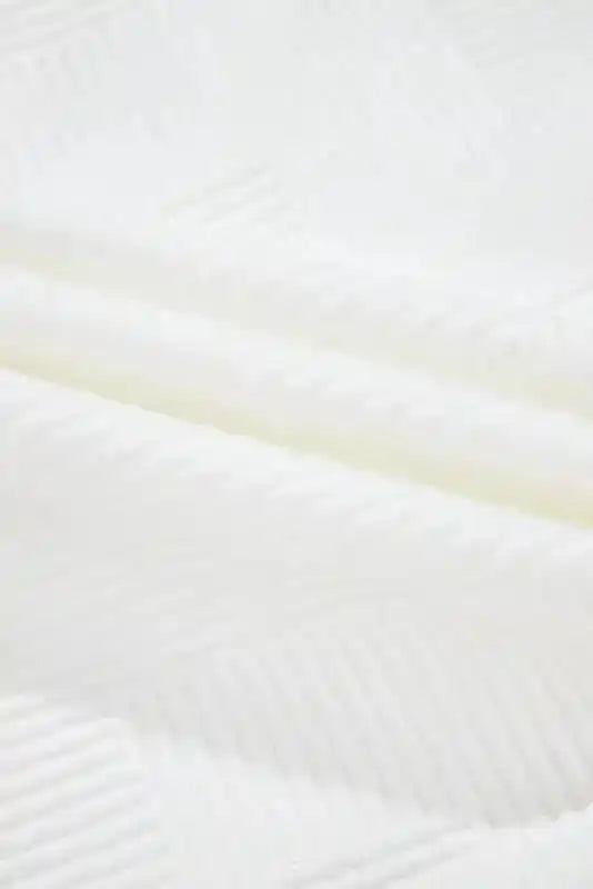 Detailed view of ribbed textured fabric on plus size jacket, emphasizing its soft and cozy winter-ready material.