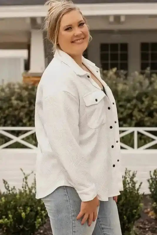 Side profile of plus size textured jacket with button-up front and long sleeves, offering a flattering and casual winter look.