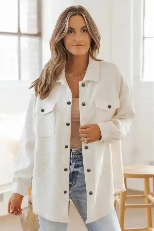 Front view of a woman modeling a textured plus size jacket in white, ideal for daily winter wear with a relaxed fit.