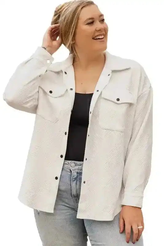 Isolated view of model in white textured plus size jacket with black buttons, highlighting its versatile winter design.