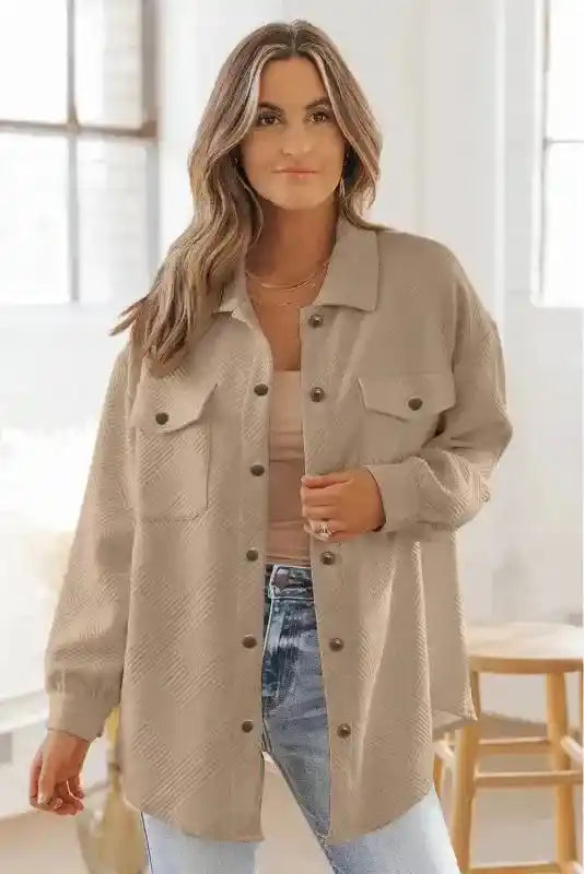 Front view of beige textured plus size jacket worn by model, highlighting its relaxed fit and winter-ready design.