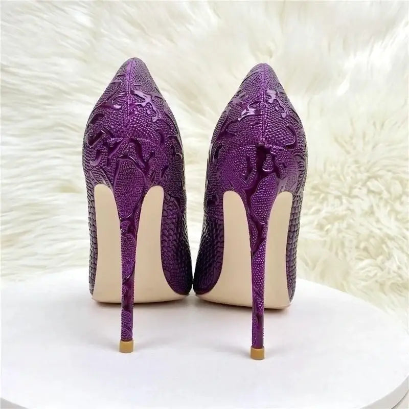 Purple embossed stiletto pumps