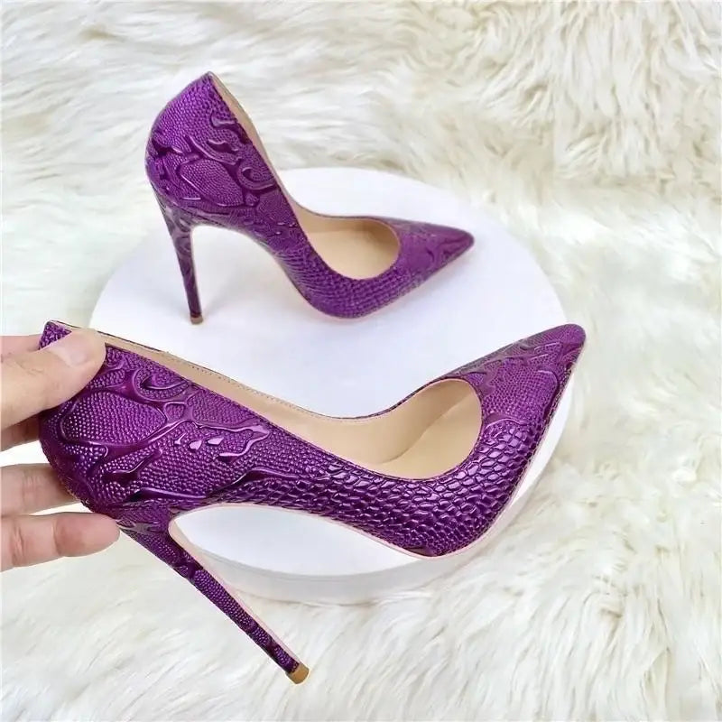 Purple embossed stiletto pumps