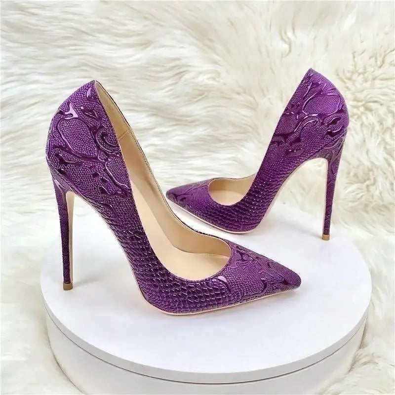 Purple embossed stiletto pumps