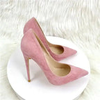 Side view of pink suede high heel stilettos with pointed toe, perfect for stylish and sophisticated ensembles.