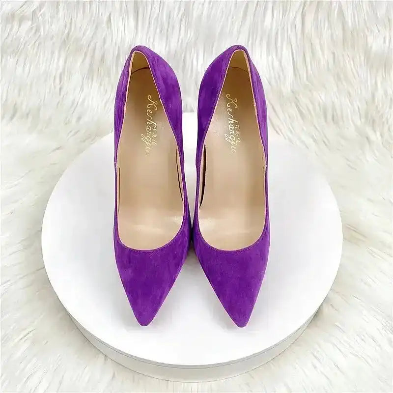 Top view of purple suede stiletto pumps with pointed toe, part of the FashionFitz Exclusive collection for bold fashion statements.