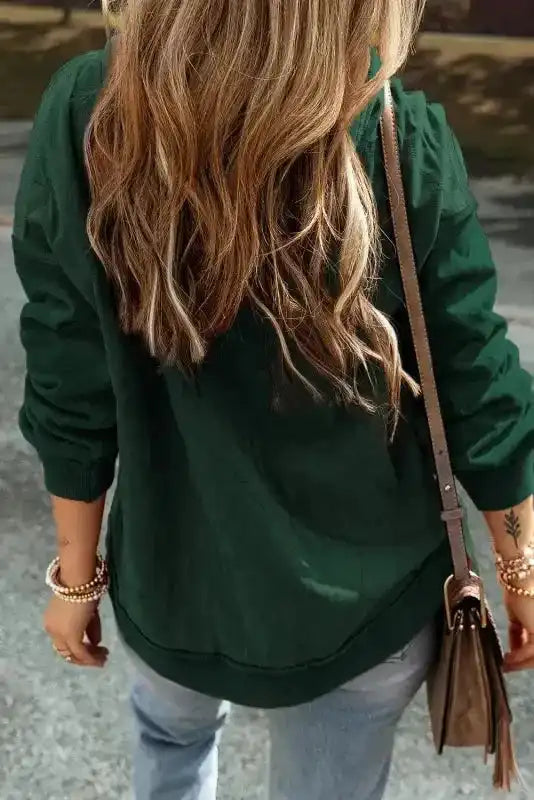Rear view of green Quilted Patchwork Hoodie highlighting exposed seams and relaxed silhouette, perfect for cozy fall layering.
