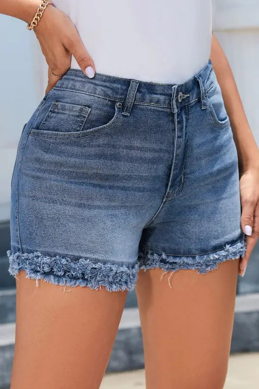 Raw hem high waist denim shorts with frayed edges, perfect for a relaxed casual look