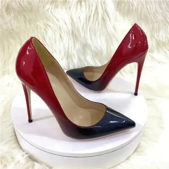 Pair of Red-Black Gradient High Heels Stilettos displayed on round platform. FashionFitz pumps with bold color contrast and high stiletto heels.