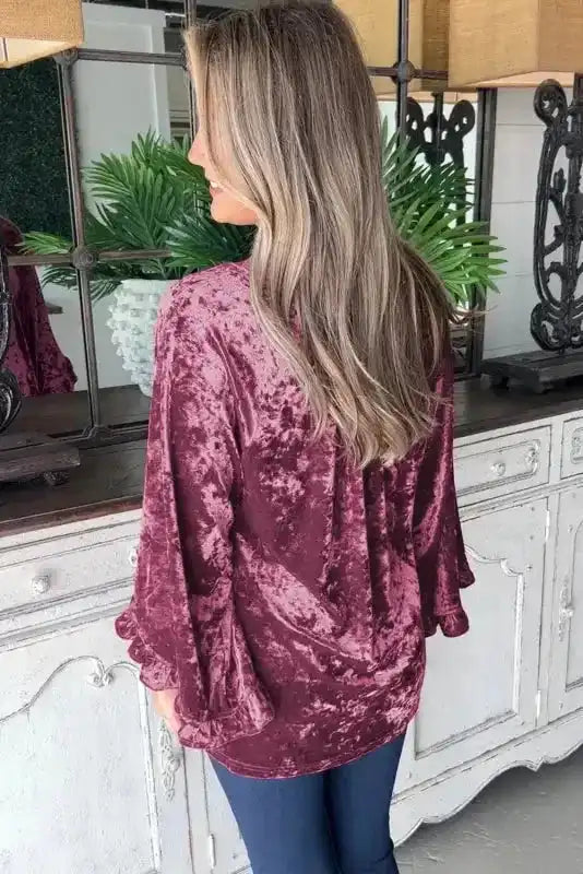 Back view of the Red Dahlia Velvet Pagoda Sleeve Top showing relaxed fit and soft velvet texture, ideal for daily wear.