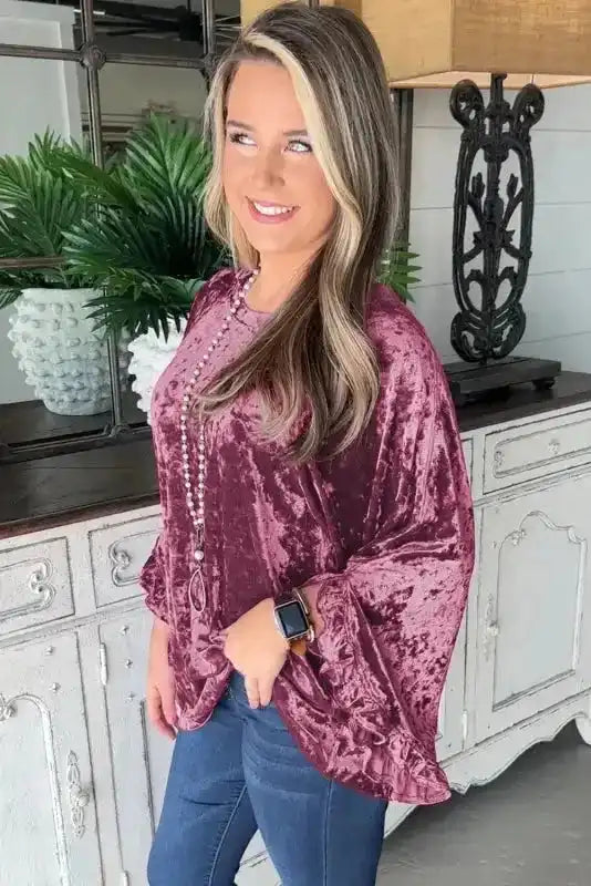 Side view of the Velvet Pagoda Sleeve Top - Red Dahlia featuring voluminous sleeves and elegant drape for a Southern Belle style.