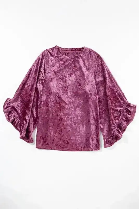 Flat lay of Velvet Pagoda Sleeve Top - Red Dahlia showing crew neck and dramatic ruffled sleeves in soft velvet fabric.