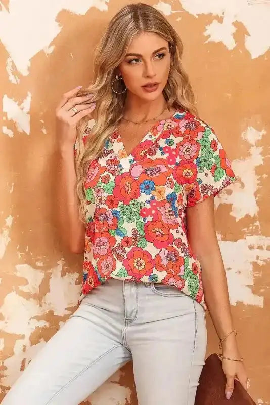 Side view of Floral Split Neck Short Sleeve Top showing split V-neckline and floral print drape — Fashionfitz