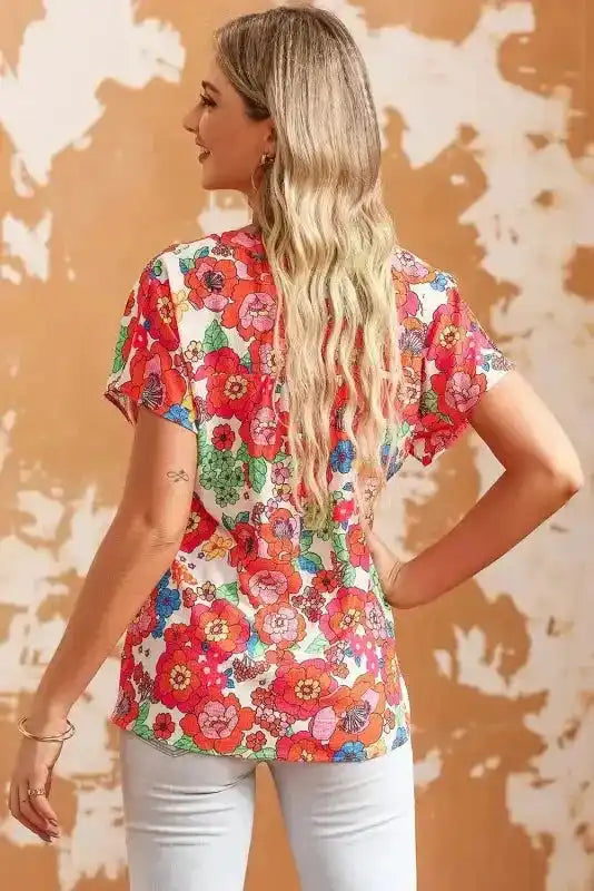 Back view of Floral Split Neck Short Sleeve Top showing short sleeve silhouette and cropped fit — Fashionfitz