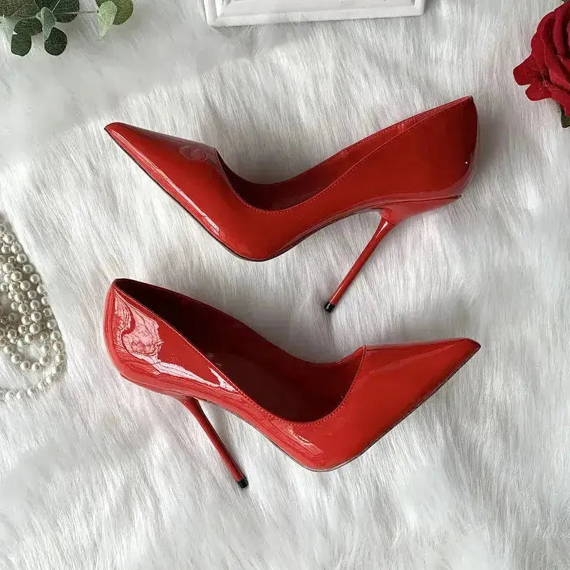 Close-up of thin stiletto heel and pointed toe on red pumps Fashionfitz UK