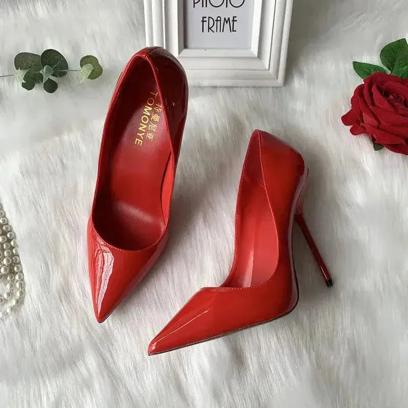 Red stiletto pumps angled view showing needle-thin heel construction Fashionfitz UK