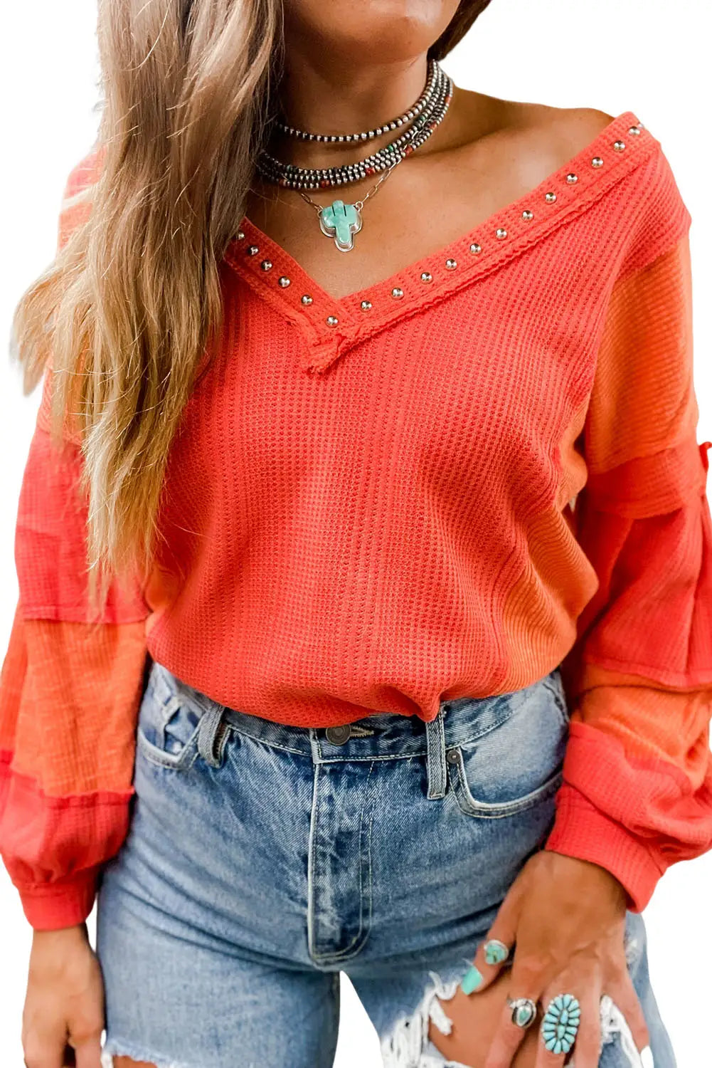 Red studded v neckline exposed seam textured knit top - long sleeve tops
