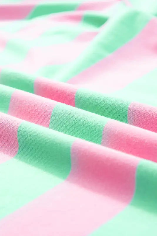 Colorful striped fabric in pink and mint green on relaxed elegance tee for a relaxed look