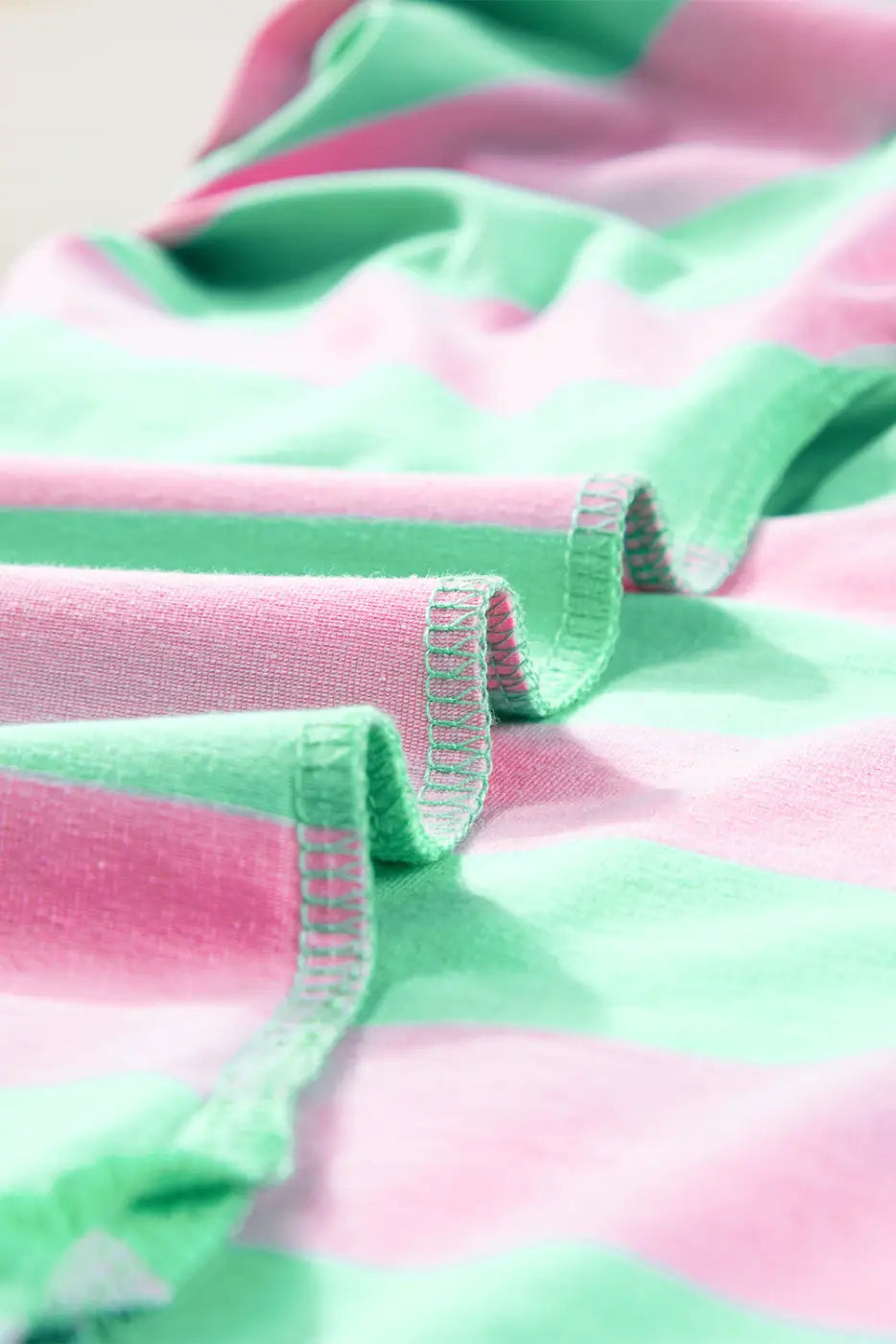 Relaxed elegance tee: soft fabric with pink and mint green stripes, visible stitching