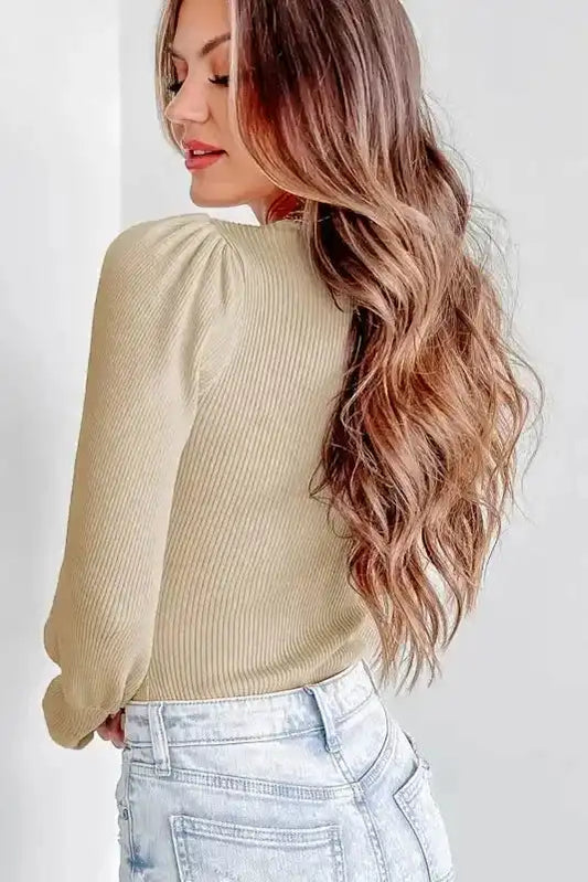 Back view of beige Ribbed Balloon Sleeve Bodysuit showing textured ribbed fabric and puff sleeve detail, ideal for fall fashion.