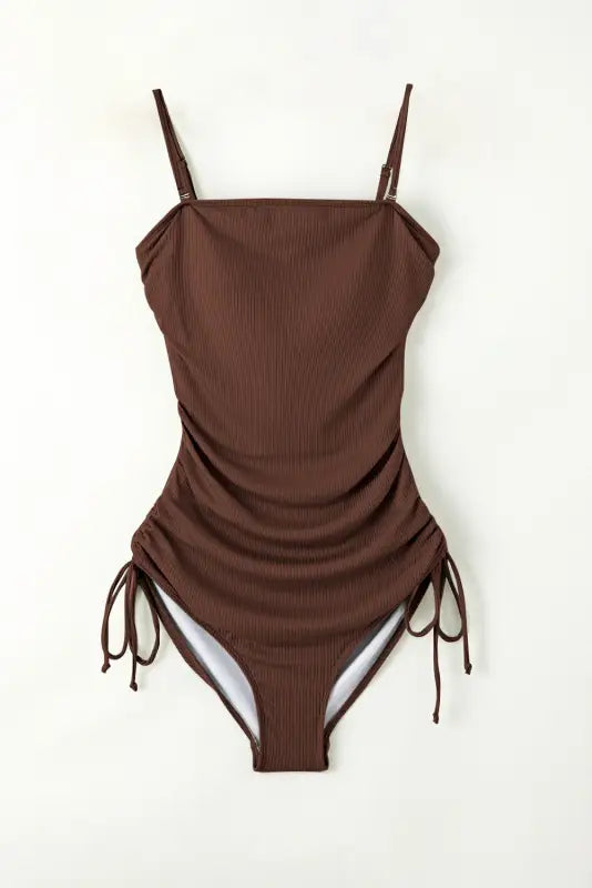 Brown ribbed one-piece swimsuit with ruched sides and adjustable drawstrings for waist length hip