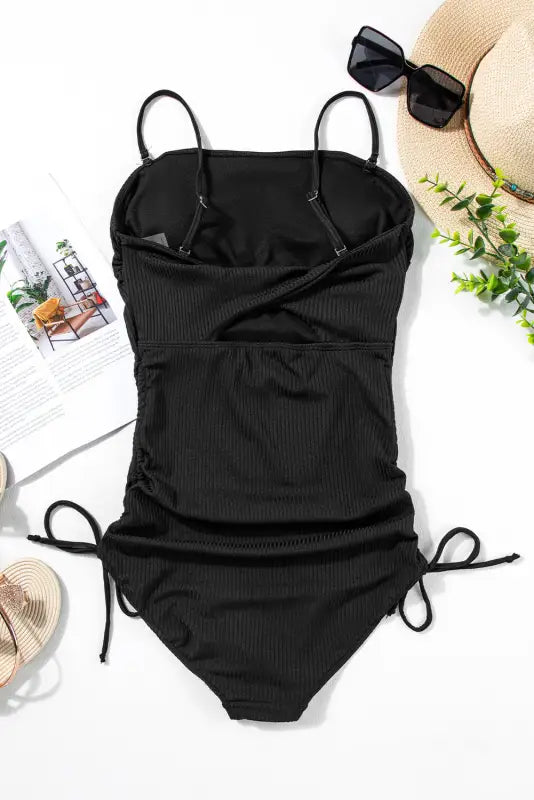 Black ribbed one-piece swimsuit with adjustable sides and spaghetti straps - sizes bust waist