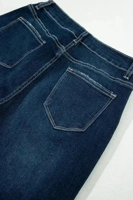 Detailed view of back pocket stitching on Ripped Bell Bottom Jeans, showcasing craftsmanship and durable design.