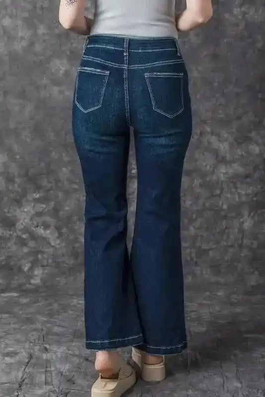 Back view of Ripped Bell Bottom Jeans on model, featuring high waist and flared legs for a flattering silhouette.