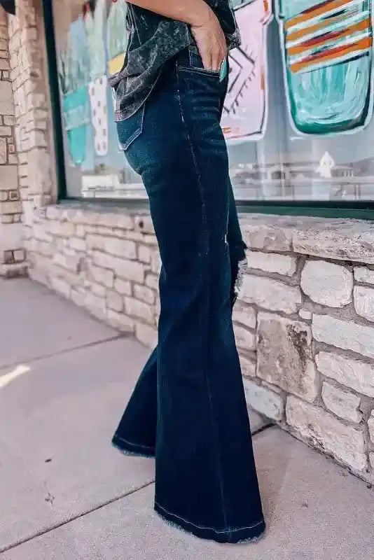 Side profile of Ripped Bell Bottom Jeans showing flare cut and distressed accents, great for western-inspired casual wear.