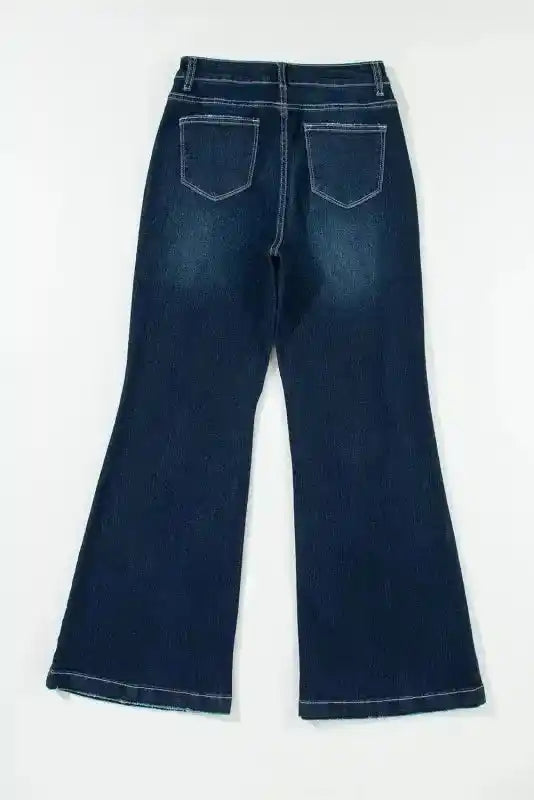 Flat lay back view of Ripped Bell Bottom Jeans with classic pocket design and flared hem for a retro vibe.