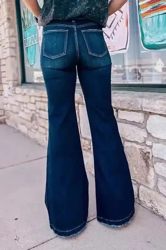 Back view of Stylish Ripped Bell Bottom Jeans with classic pockets and flared silhouette, ideal for a retro denim upgrade.