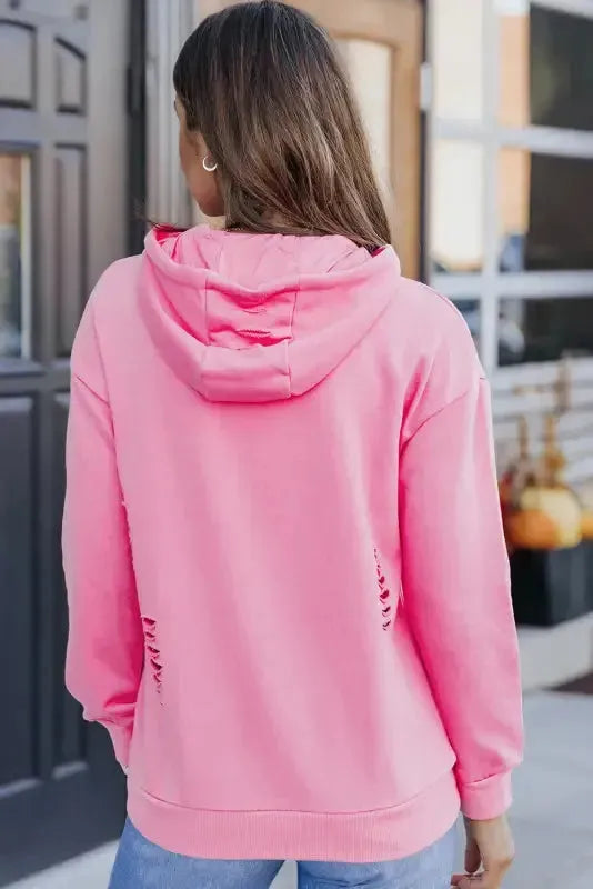 Side view of ripped distressed hoodie showing relaxed fit and hood detail Fashionfitz UK