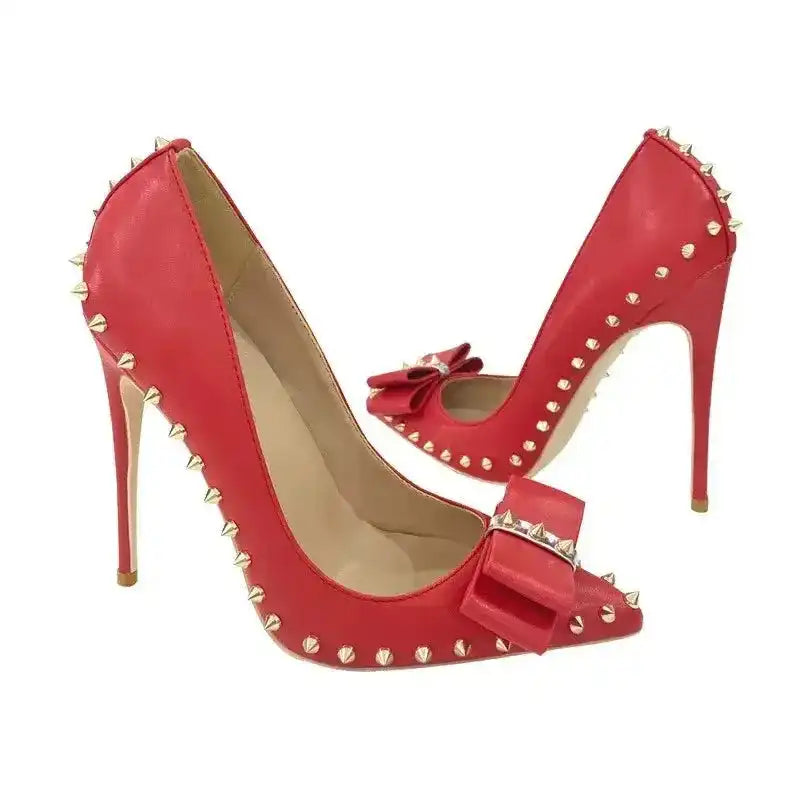 Side and front view of red Riviera Bow Court Heels with gold studs and bow, perfect for fashion-forward stiletto lovers.