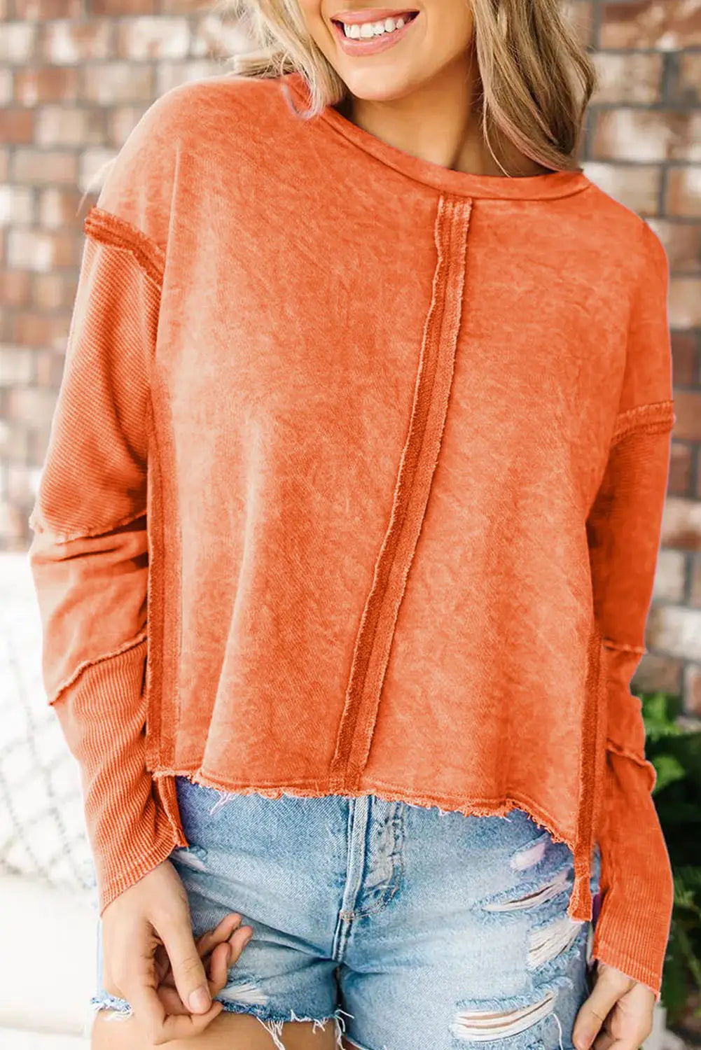 Rose exposed seamed high low raw edge sweatshirt - orange / s / 75% polyester + 25% cotton - tops