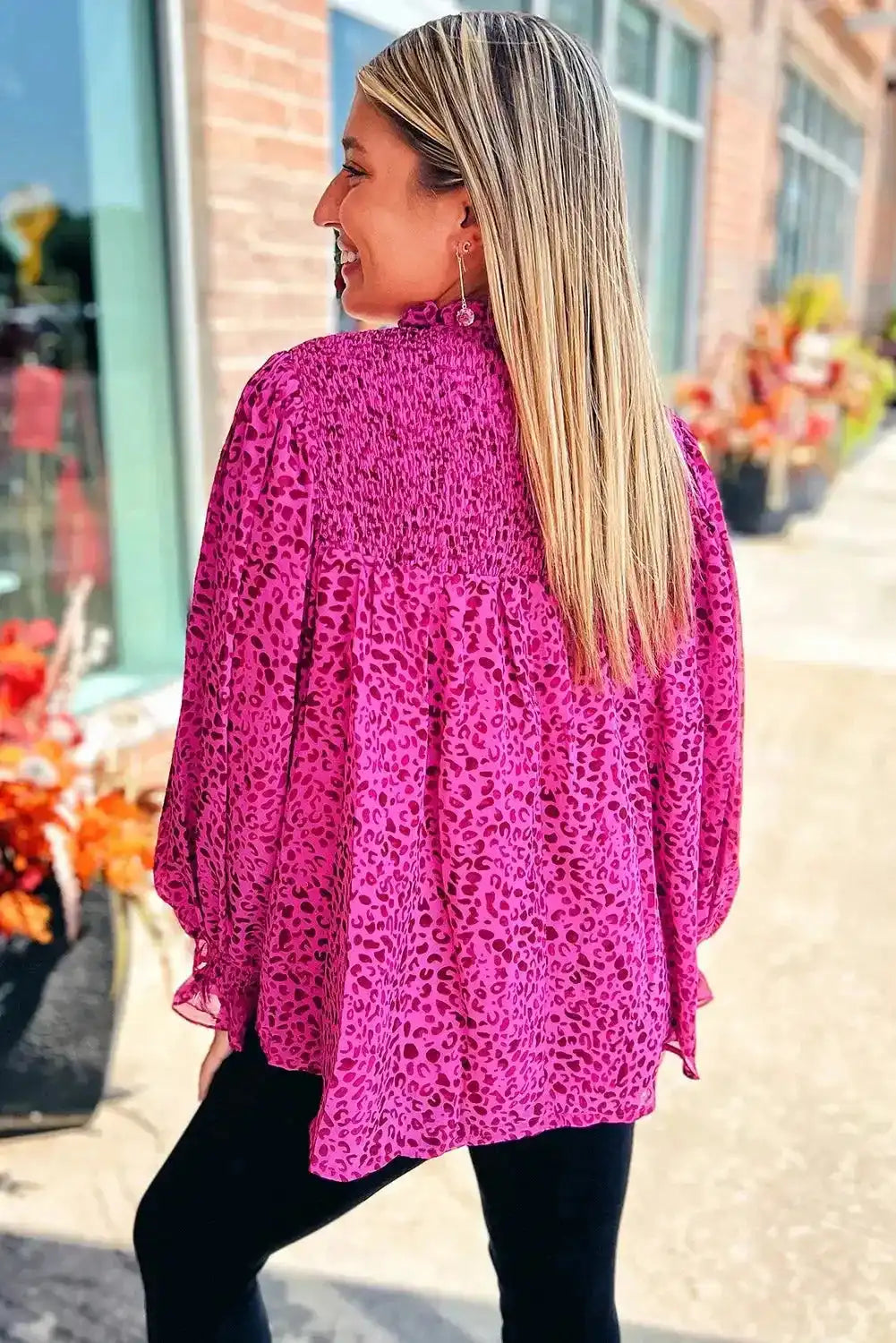 Back view of Rose Leopard Shirred Blouse showing shirred yoke and loose flowy silhouette, perfect for casual or dressy occasions.