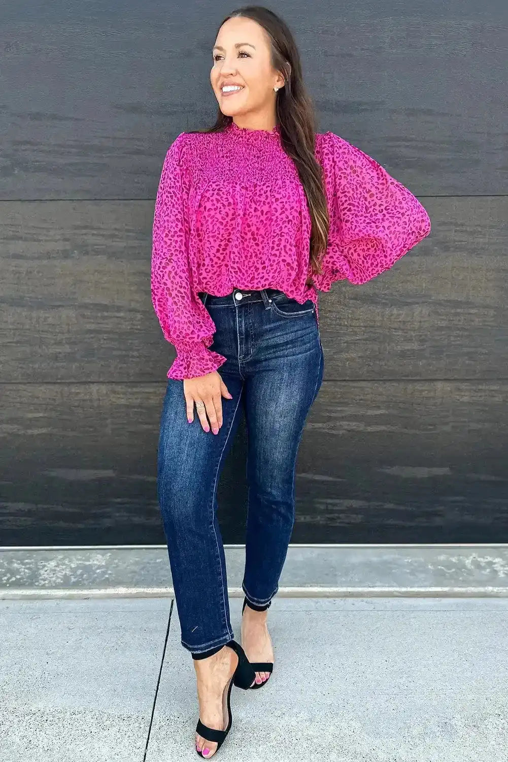 Model wearing Rose Leopard Shirred Blouse with dark denim and heels, demonstrating a versatile look for daily or Valentine's Day outfits.