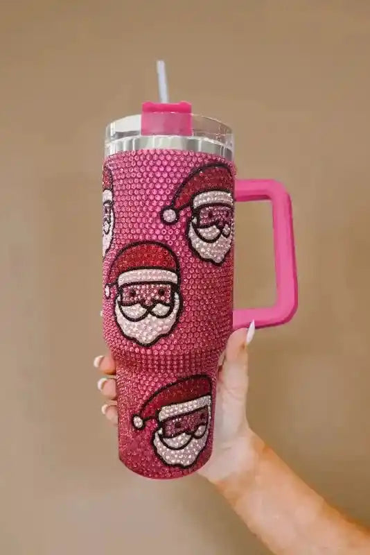 Festive pink Santa Claus thermos tumbler with diamond texture and large handle, designed for holiday sipping with hot or cold drinks.