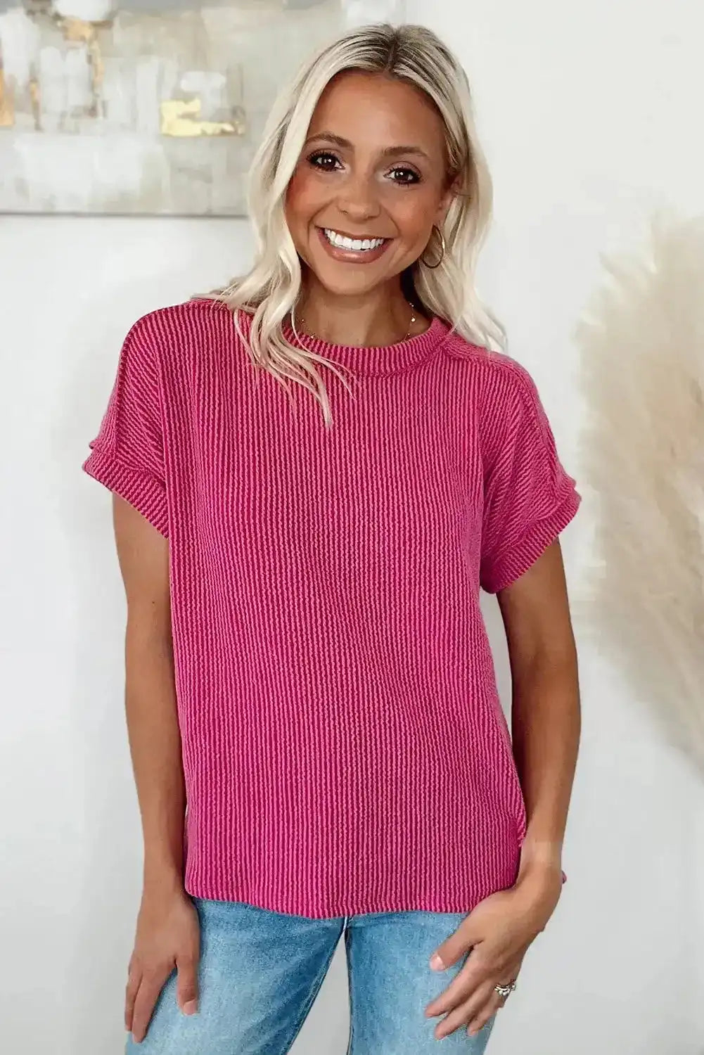 Textured Rose Red T-shirt for women, breathable knit design paired with denim, ideal for casual summer outfits.