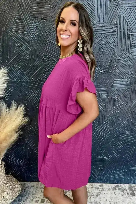 Close-up of waffle knit texture on rose red shift dress, ruffled cap sleeve detail, Fashionfitz UK