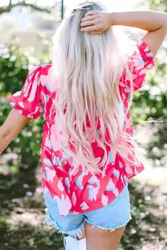 Back view of Smocked Puff Sleeve Ruffle Hem Blouse showing loose shift silhouette and ruffle hem detail — Fashionfitz