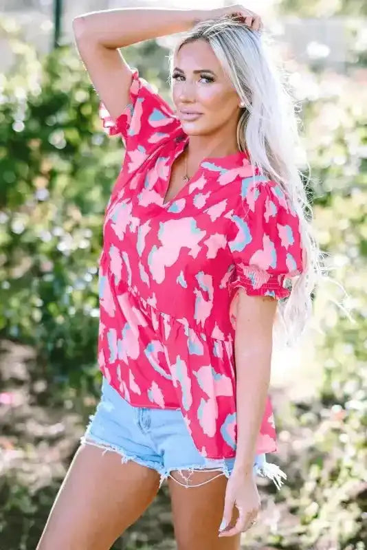 Close-up of Smocked Ruffle Hem Blouse showing smocked bodice detail and abstract rose print fabric — Fashionfitz