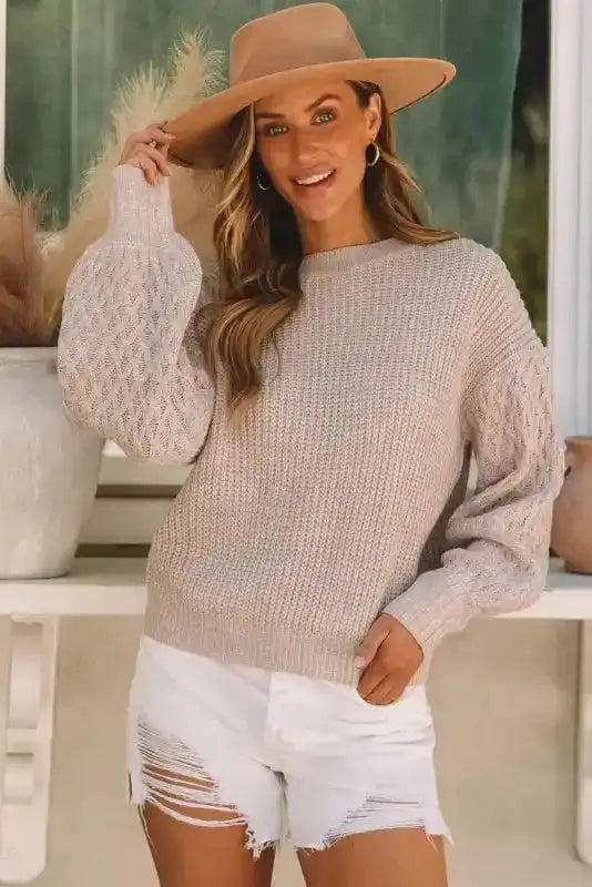 Model wearing Beige Cable Knit Sleeve Drop Shoulder Sweater with balloon sleeves and relaxed fit, styled for a chic casual look.