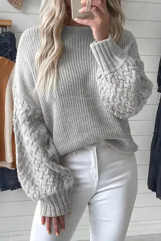 Sea Green Cable Knit Sleeve Drop Shoulder Sweater featuring chunky cable-knit sleeves and ribbed texture, paired with white jeans for a cozy daily outfit.