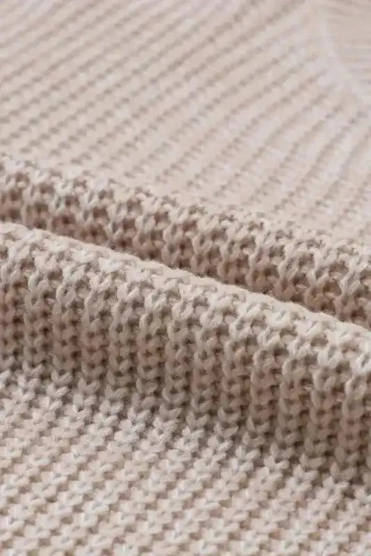 Macro shot of knit texture on Beige Cable Knit Sleeve Drop Shoulder Sweater highlighting the cozy and breathable fabric.
