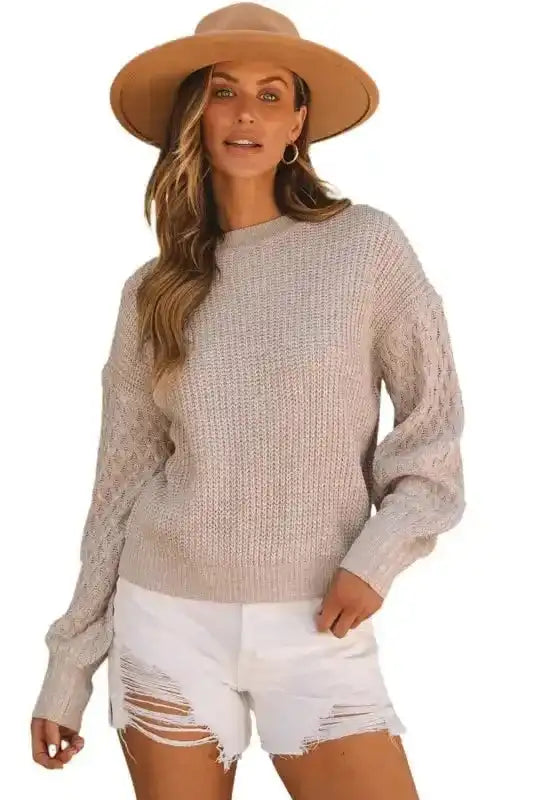 Sea Green Cable Knit Sleeve Drop Shoulder Sweater with textured sleeves and relaxed fit, styled with white distressed shorts for a casual winter look.