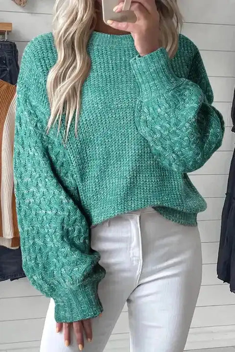 Sea Green Cable Knit Sleeve Drop Shoulder Sweater with long sleeves and textured knit pattern, styled with white jeans for a cozy winter look.