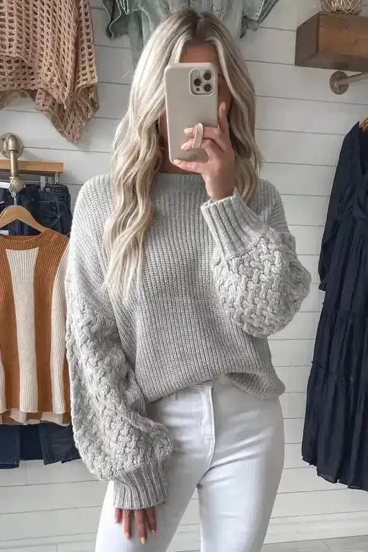 Sea Green Cable Knit Sleeve Drop Shoulder Sweater styled with white pants, showcasing balloon sleeves and ribbed knit texture for a trendy winter outfit.